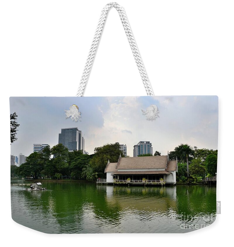 Lake Weekender Tote Bag featuring the photograph Lake and house with skyline at Lumphini Park Bangkok Thailand by Imran Ahmed