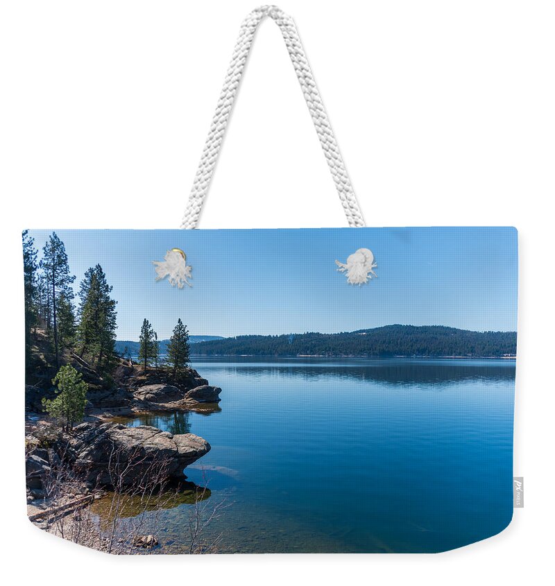 Lake Weekender Tote Bag featuring the photograph Lake Coeur D'Alene Shore by Matthew Nelson
