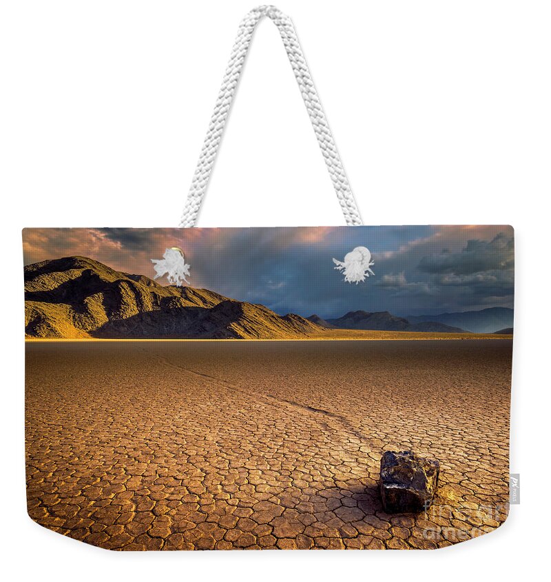 Sliding Rock Weekender Tote Bag featuring the photograph Last light on the Grandstand, Racetrack Playa, Death Valley, California by Neale And Judith Clark