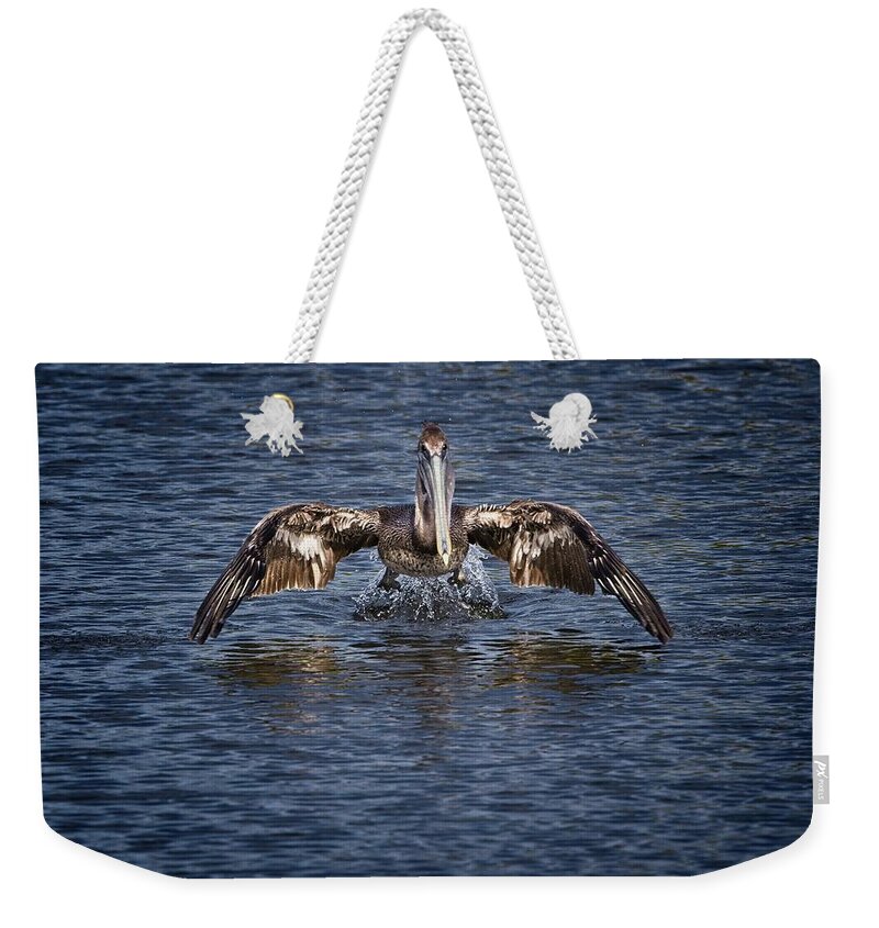 Brown Pelican Weekender Tote Bag featuring the photograph Liftoff by Ronald Lutz