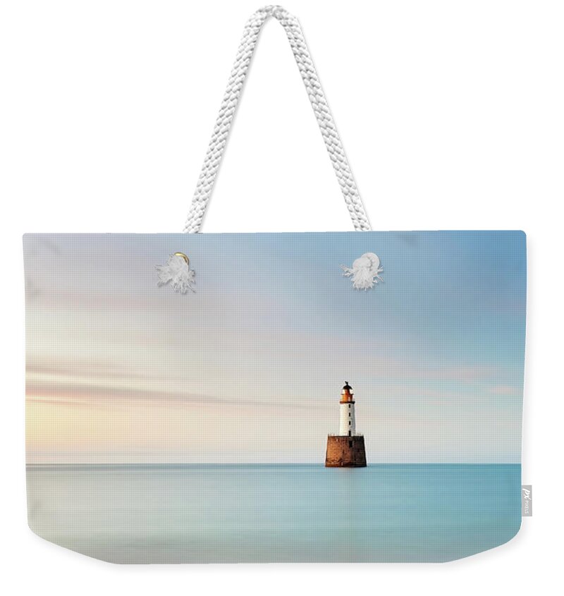 Rattray Head Lighthouse Weekender Tote Bag featuring the photograph Lighthouse Blues by Grant Glendinning
