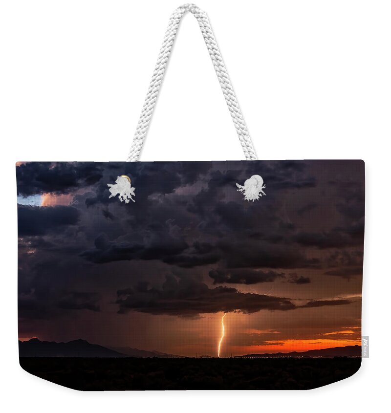 Lightning Weekender Tote Bag featuring the photograph Lighting Up The Estrellas At Sunset by Saija Lehtonen