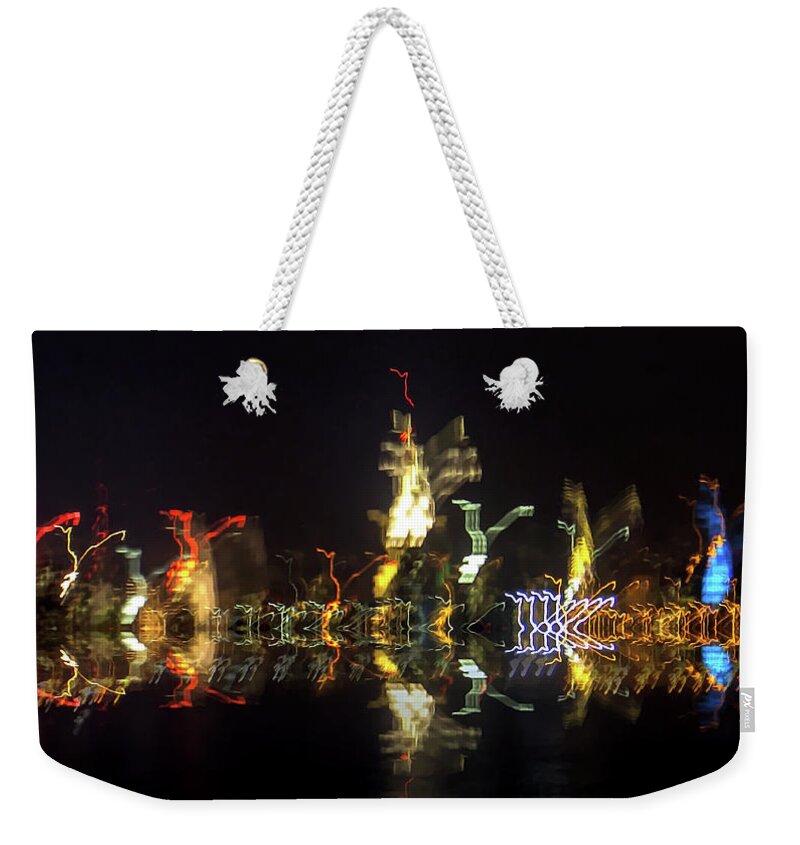 Lights Reflection Of Nyc Skyline Weekender Tote Bag featuring the photograph lights reflection of NYC skyline by Habib Ayat