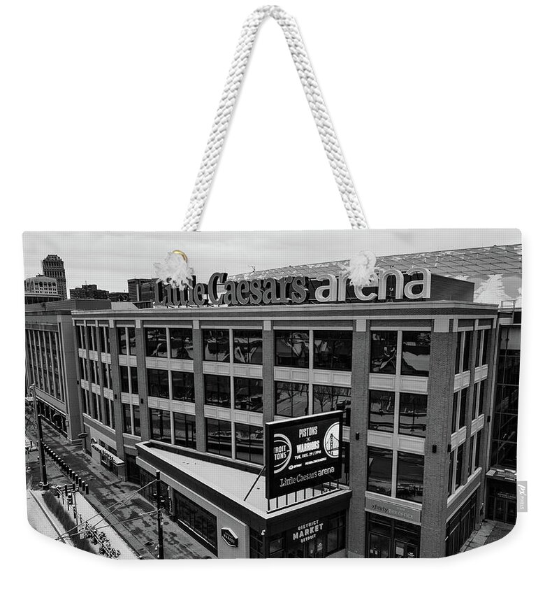 Michigan Weekender Tote Bag featuring the photograph Little Caesars Arena in Detroit Michigan in Black and White by Eldon McGraw