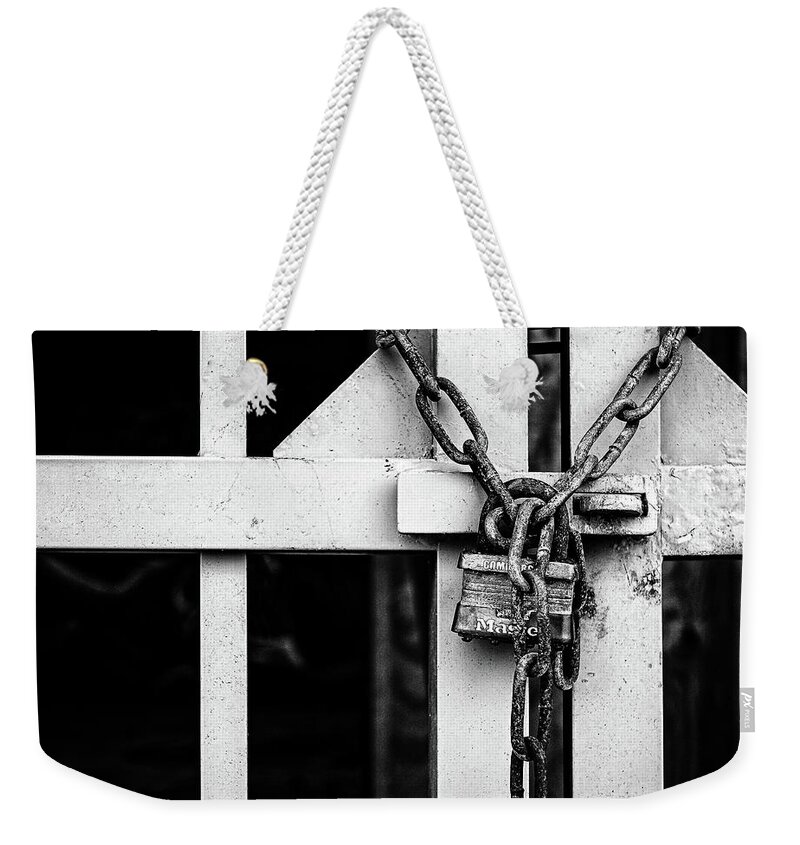  Weekender Tote Bag featuring the photograph Lock And Chain by Steve Stanger
