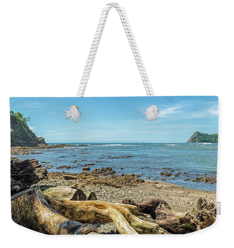 Central America Weekender Tote Bag featuring the photograph Logs and stumps washed up on Bella Vista beach - Samara by Henri Leduc