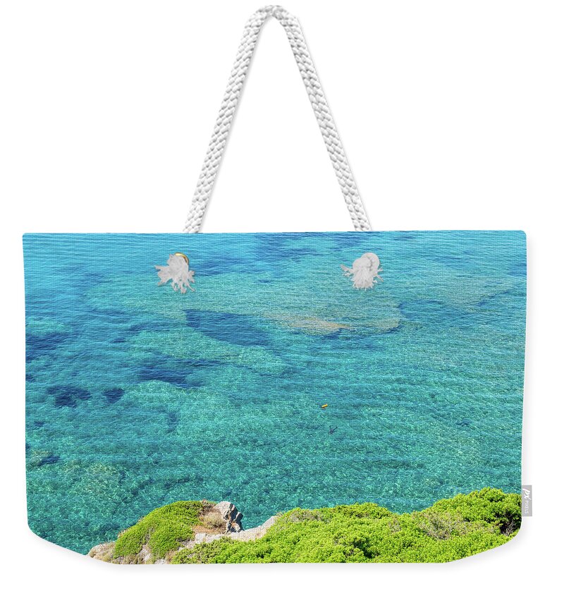 Sardinian Seascape Weekender Tote Bag featuring the photograph Lone Diver in a Sardinian Seascape by Benoit Bruchez
