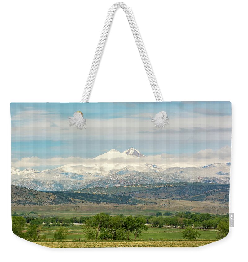 Twin Peaks Weekender Tote Bag featuring the photograph Longs Peak after a Spring Snow by Aaron Spong