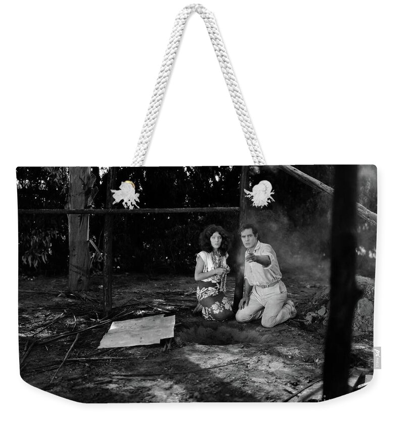 Lost And Found Weekender Tote Bag featuring the photograph Lost and Found on a South Sea Island 1923 Antonio Moreno Pauline by Sad Hill - Bizarre Los Angeles Archive