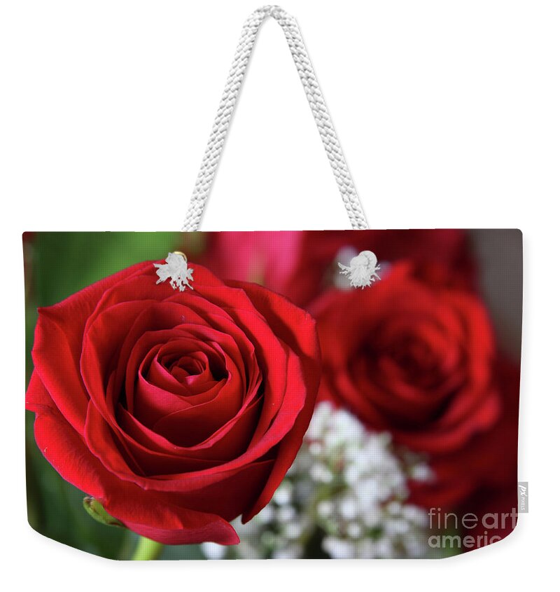Red Roses Weekender Tote Bag featuring the photograph Love is in the Air by Jayne Carney