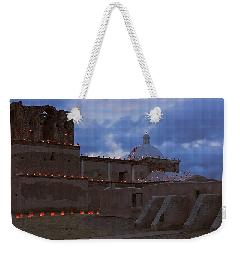 Tom Daniel Weekender Tote Bag featuring the photograph Luminarias and Buttresses by Tom Daniel