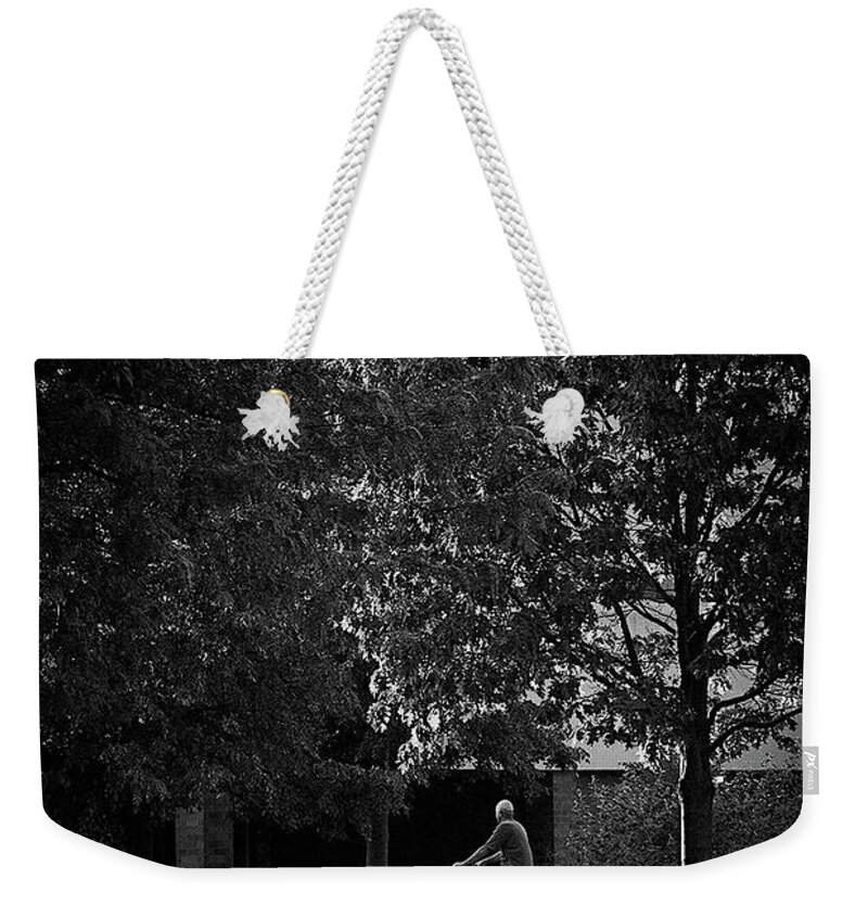 Bicycle Weekender Tote Bag featuring the photograph Man on a Bike Taking a Time Out by Frank J Casella