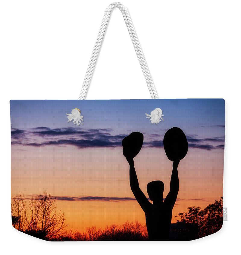 Man With Two Hats Weekender Tote Bag featuring the photograph Man with two hats in the sunset light by Tatiana Travelways