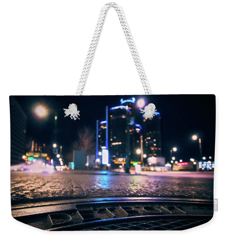 Detroit Weekender Tote Bag featuring the photograph Manhole in the Shadows of Detroit... by Jay Smith