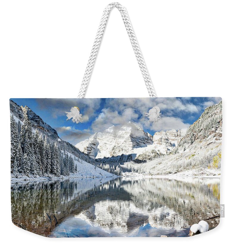 Colorado Weekender Tote Bag featuring the photograph Snow covered Maroon Bells in Aspen, Colorado. by Lena Owens - OLena Art Vibrant Palette Knife and Graphic Design