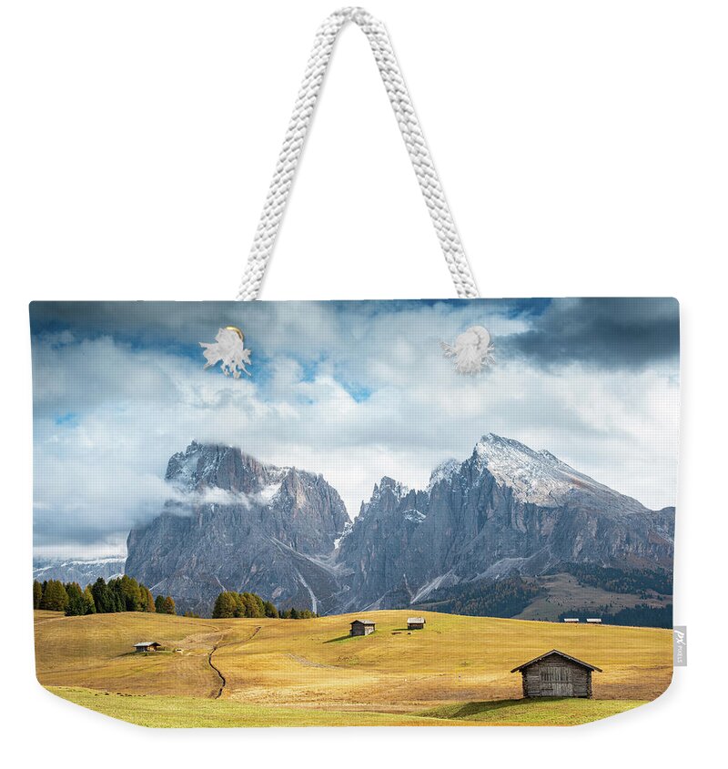Mountain Landscape Weekender Tote Bag featuring the photograph Meadow field and the Dolomiti rocky peaks Alpe di siusi Seiser Alm Italy by Michalakis Ppalis