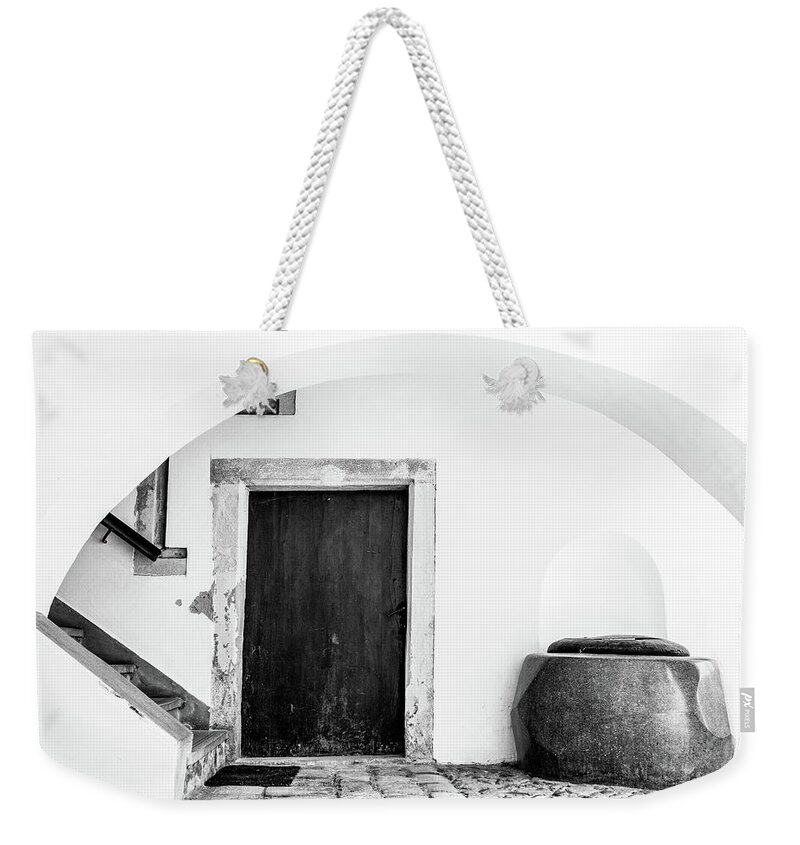 Ancient Weekender Tote Bag featuring the photograph Medieval gateway with stairs, door and well by Viktor Wallon-Hars