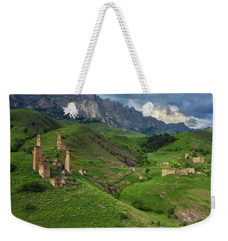 Tower Weekender Tote Bag featuring the photograph Medieval tower complex in mountains by Mikhail Kokhanchikov