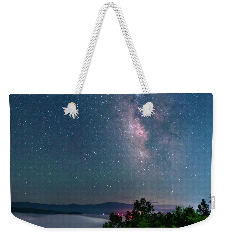 Milky Way Weekender Tote Bag featuring the photograph Milky Way over the clouds by Darrell DeRosia