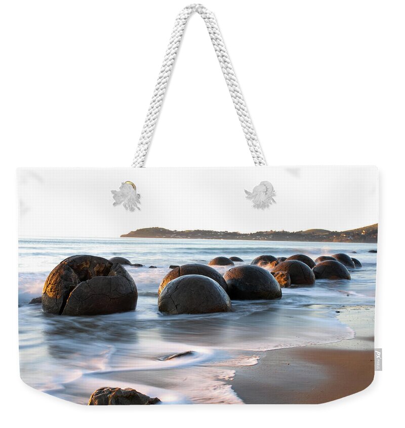 Moeraki Weekender Tote Bag featuring the photograph Tranquility - Moeraki Boulders, South Island. New Zealand by Earth And Spirit