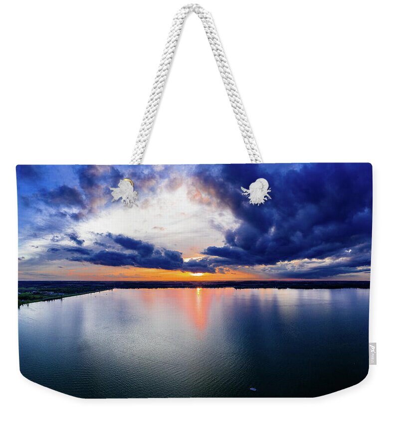  Weekender Tote Bag featuring the photograph Moody Sunset by Brian Jones