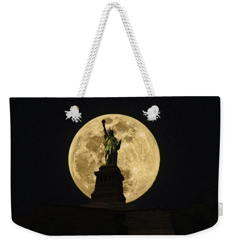 Statue Of Liberty Weekender Tote Bag featuring the photograph Moon Lit Statue of Liberty by Montez Kerr