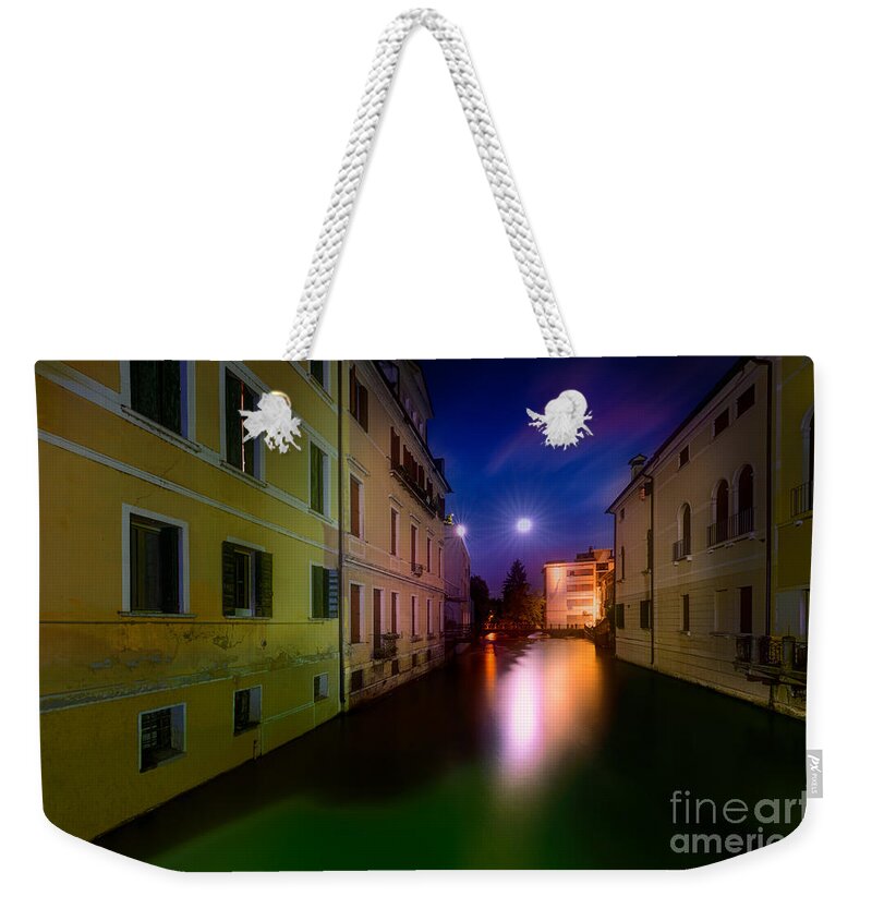 Treviso Weekender Tote Bag featuring the photograph Moon reflections in Treviso Italy by The P
