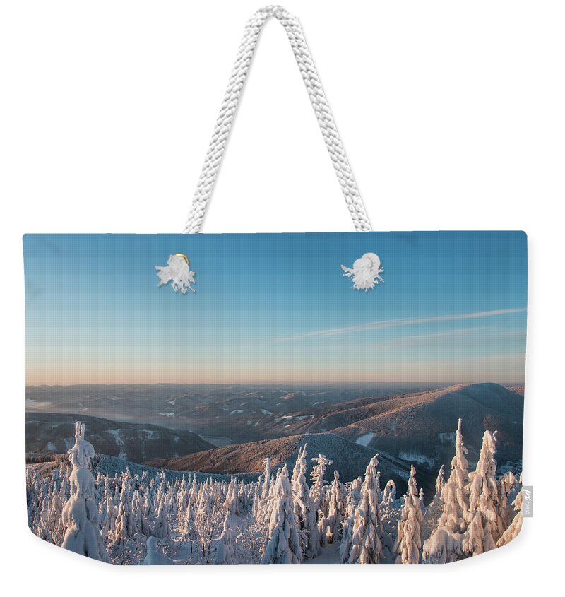 Snowboarding Weekender Tote Bag featuring the photograph Morning awakening in a snowy landscape by Vaclav Sonnek