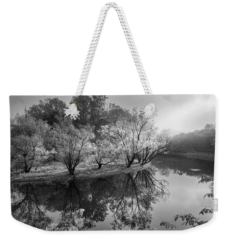 Black Weekender Tote Bag featuring the photograph Morning Reflections on the River Black and White by Debra and Dave Vanderlaan