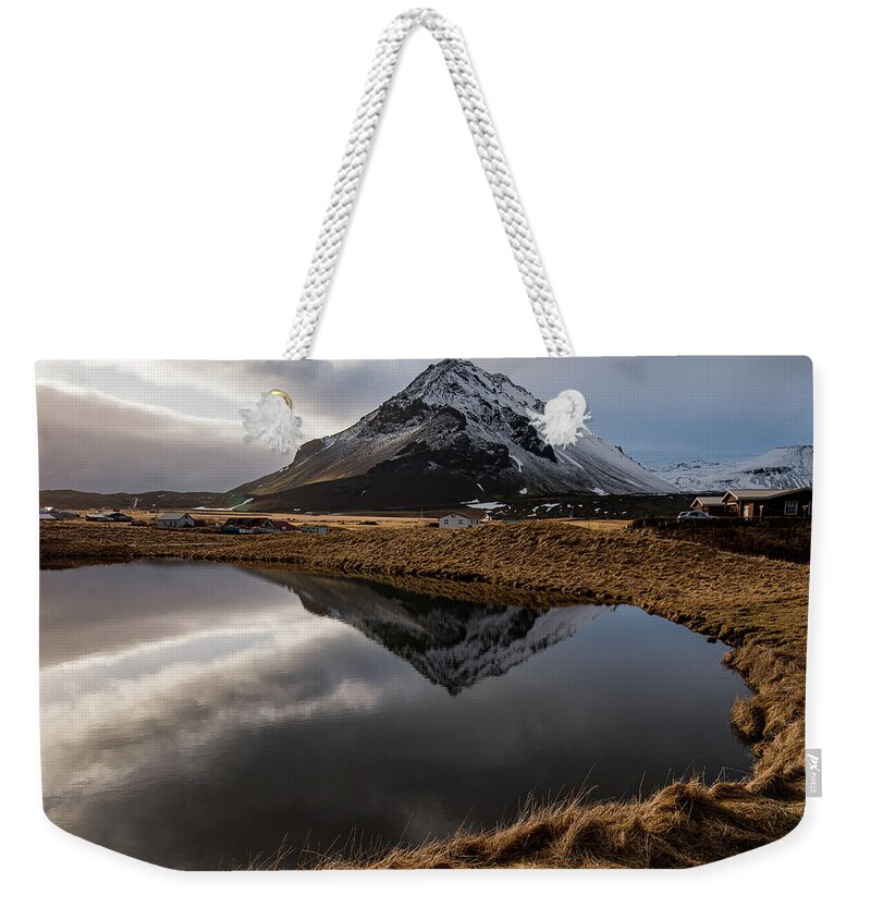 Arnarstapi Weekender Tote Bag featuring the photograph Mountain landscape at and hilltop reflection at a lake. by Michalakis Ppalis