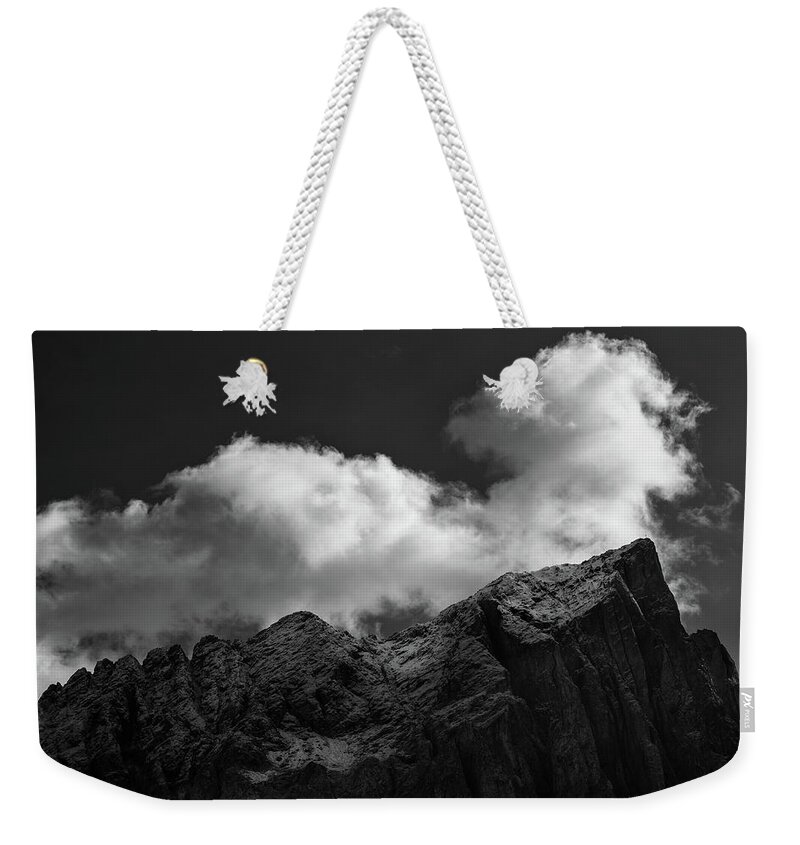 Dolomite Weekender Tote Bag featuring the photograph Mountain landscape with cloudscapes covering the mountain peaks by Michalakis Ppalis