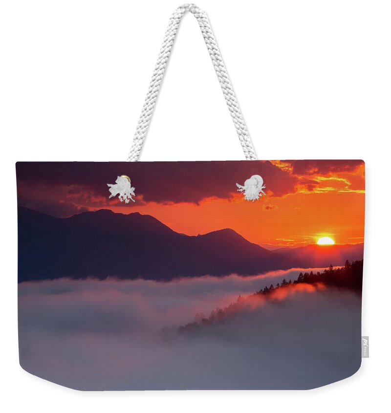 Sunrise Weekender Tote Bag featuring the photograph Mountain sunrise by Ian Middleton