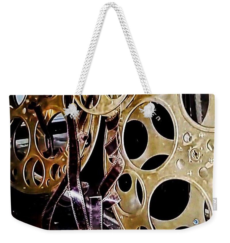  Weekender Tote Bag featuring the photograph Movie reels by Stephen Dorton