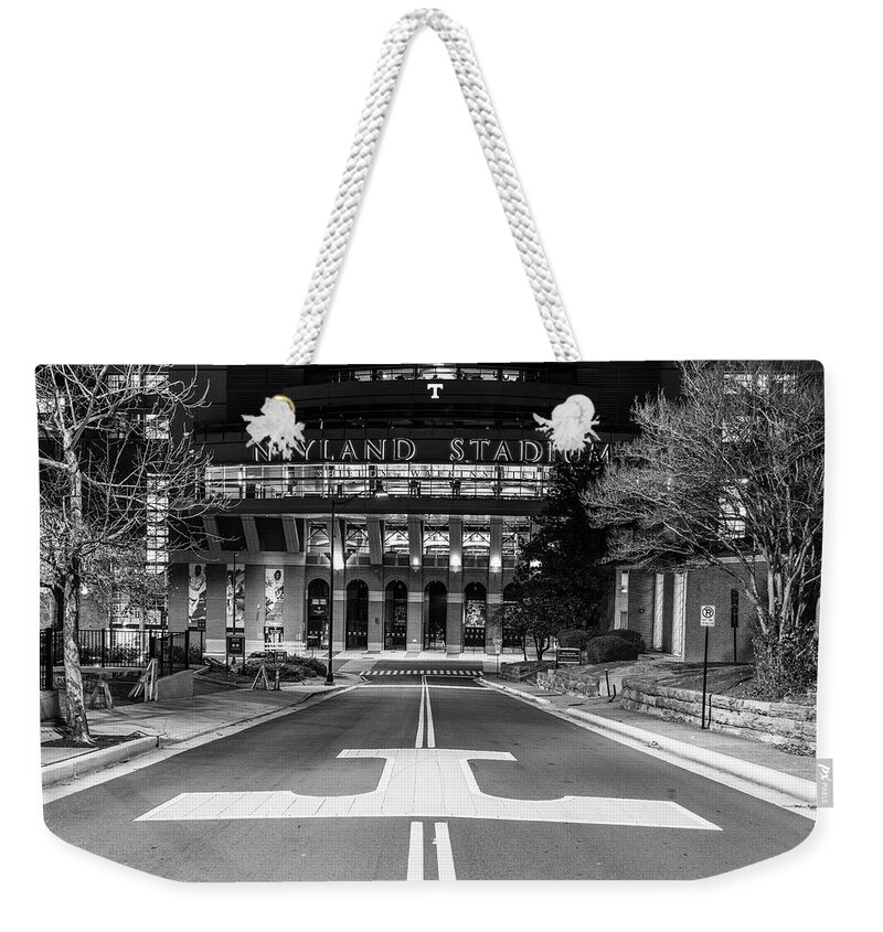 University Of Tennessee At Night Weekender Tote Bag featuring the photograph Neyland Stadium at the University of Tennessee at night in black and white by Eldon McGraw