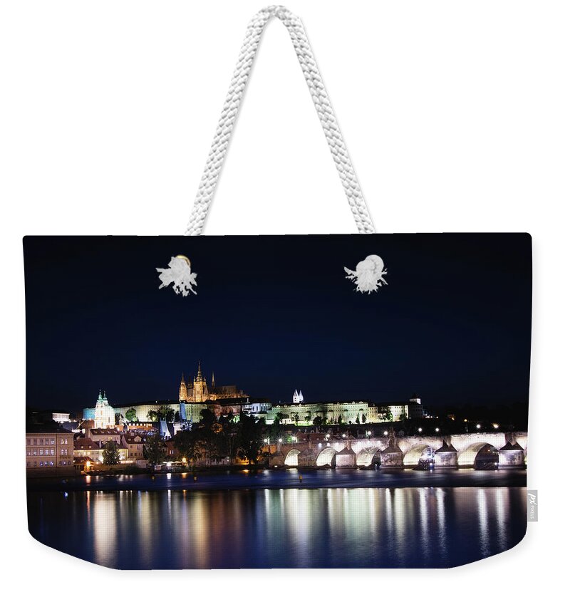 Lamps Weekender Tote Bag featuring the photograph Night view of the old town of Prague with Prague Castle by Vaclav Sonnek