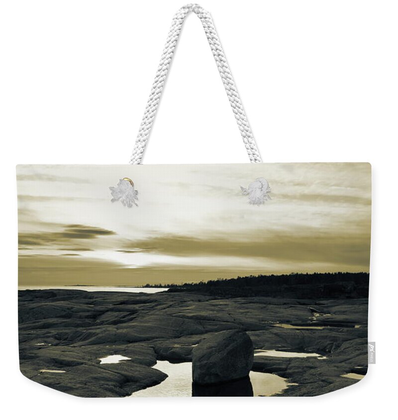 Abstract Weekender Tote Bag featuring the photograph Nightfall at the rocky shore of the Baltic Sea - duotone by Ulrich Kunst And Bettina Scheidulin