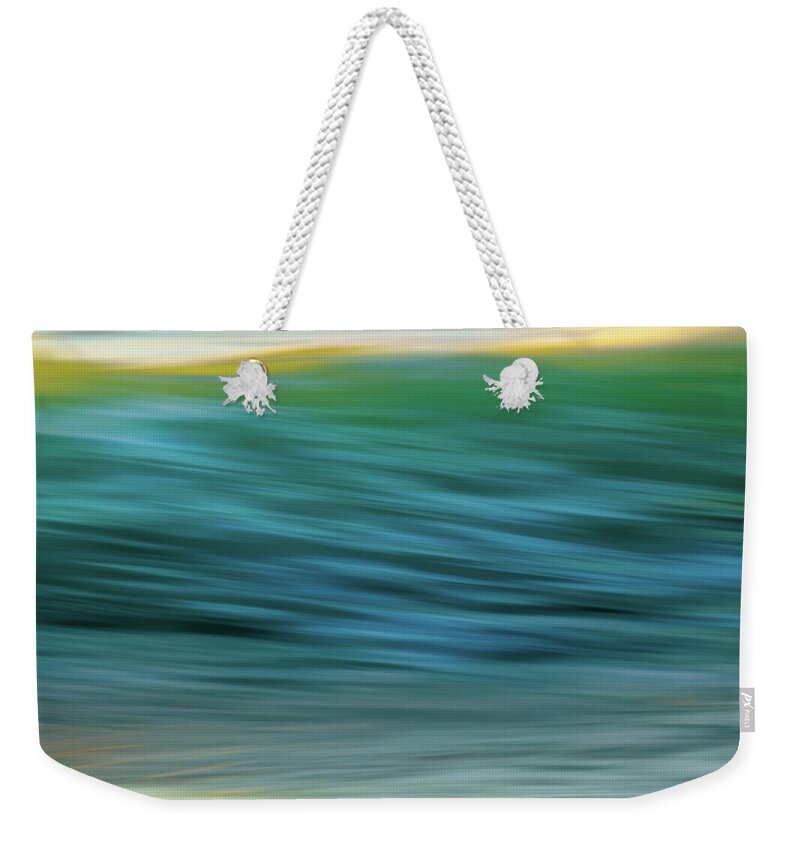 Summer Weekender Tote Bag featuring the photograph Ocean sunset. An abstract seascape by Hanna Tor