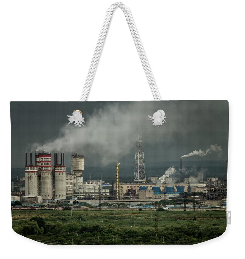 Petrochemical Weekender Tote Bag featuring the photograph Oil and gas refinery plant by Mikhail Kokhanchikov