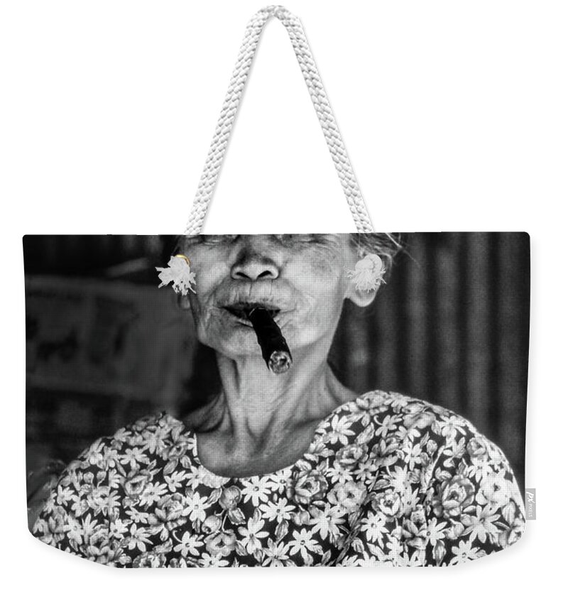 Filipina Weekender Tote Bag featuring the photograph Old lady smoking cigar by Jeremy Holton