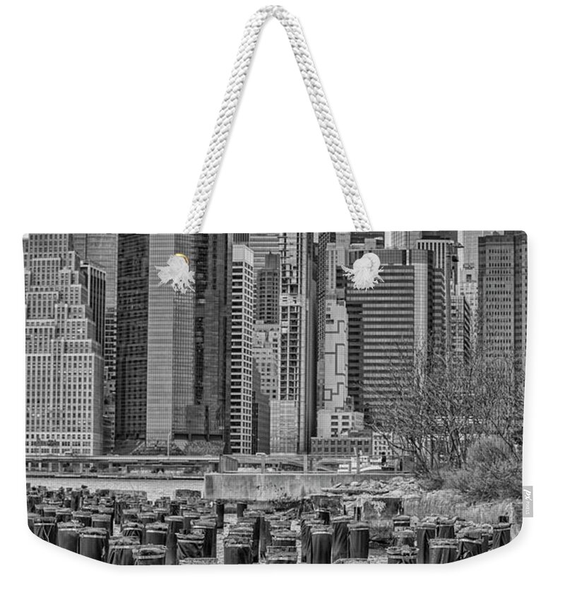 Lower Manhattan Skyline Weekender Tote Bag featuring the photograph Old Pilings and Lower Manhattan by Cate Franklyn