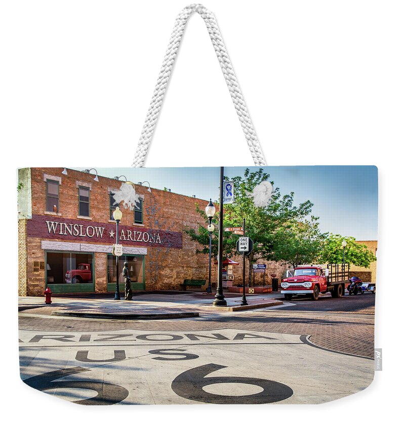 Adamson Weekender Tote Bag featuring the photograph On The Corner in Winslow Arizona by Paul LeSage