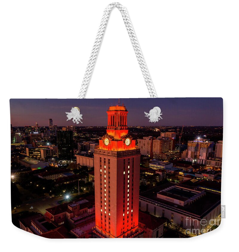 Ut Tower Weekender Tote Bag featuring the photograph Orange UT Tower lit with #1 to celebrate a national championship by Dan Herron