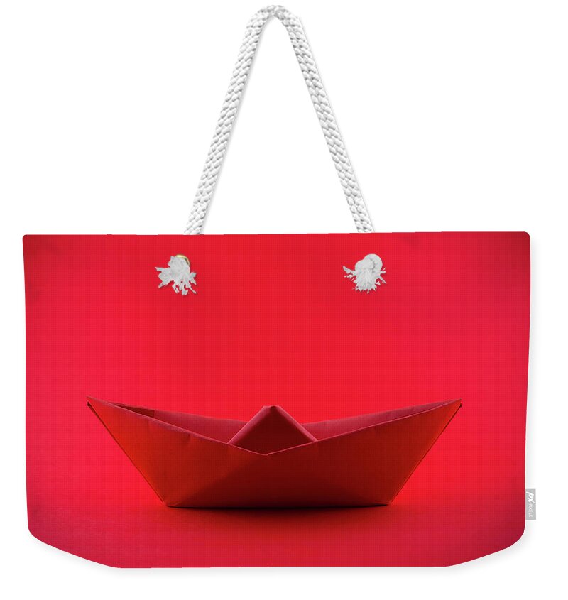 Paper Boat Weekender Tote Bag featuring the photograph Paper boat by Fabiano Di Paolo