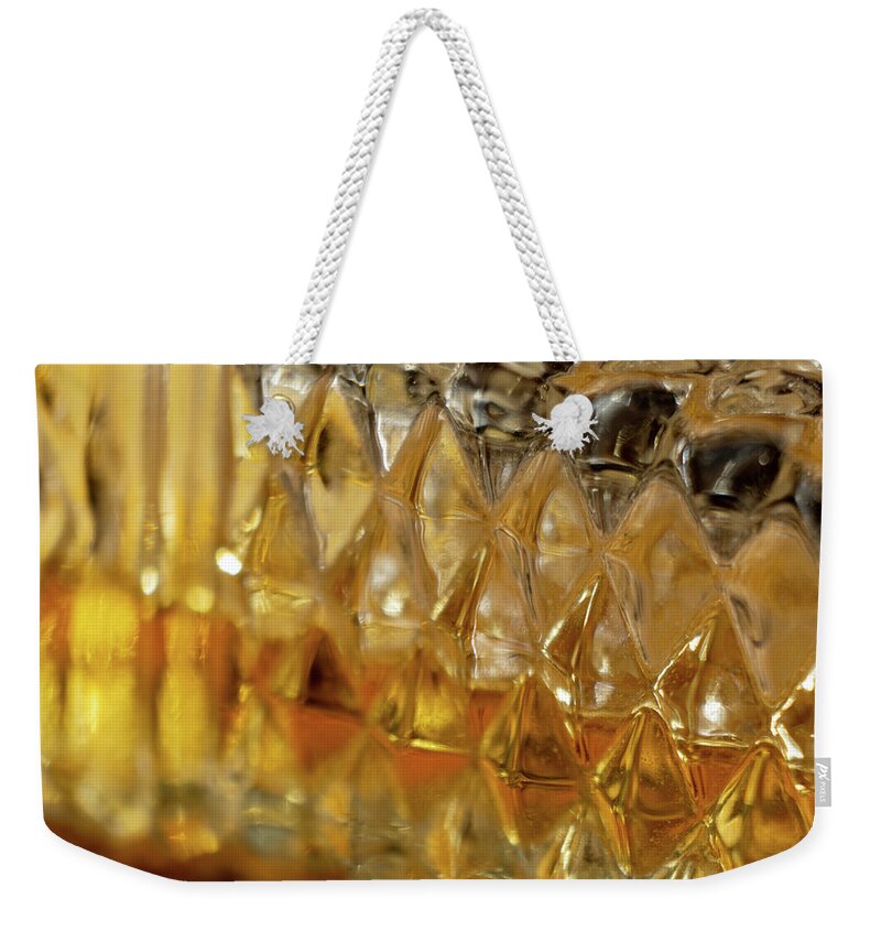 Perfume Weekender Tote Bag featuring the photograph Perfume Bottle on Cork by Rolf Bertram