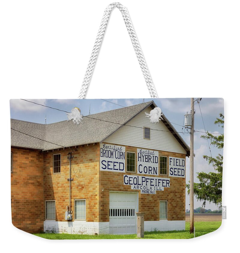Pfeifer Seed Company Weekender Tote Bag featuring the photograph Pfeifer Seed Company - Arcola, Illinois by Susan Rissi Tregoning