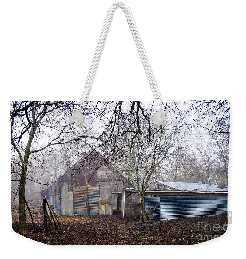 #barn #ranch #farm #country #ranch #countryliving #ranchlife #rural #vintage #metal #structure #oldbarn #texas #texasranch #farmhouse #1900s #midcentury #countrylife #ranchhand #cowboy #farming #ranching #patchwork #metal #fencing #trees #fog #winter Weekender Tote Bag featuring the photograph Pickle Creek Ranch Barn by Cheryl McClure