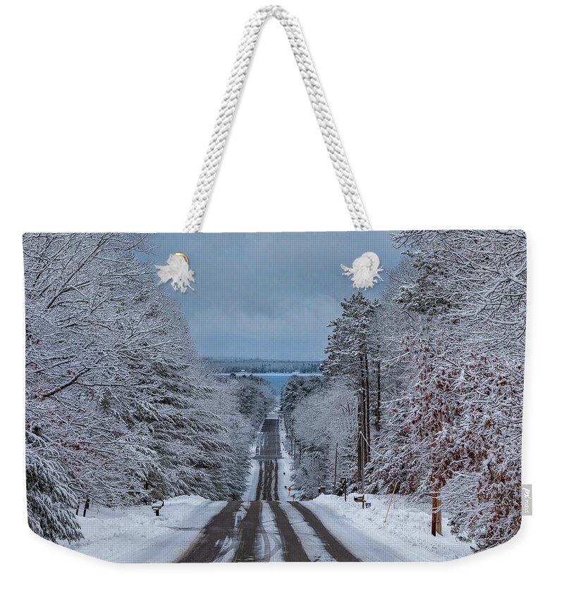 Higgins Lake Weekender Tote Bag featuring the photograph Pioneer Hill Winter Drive by Ron Wiltse