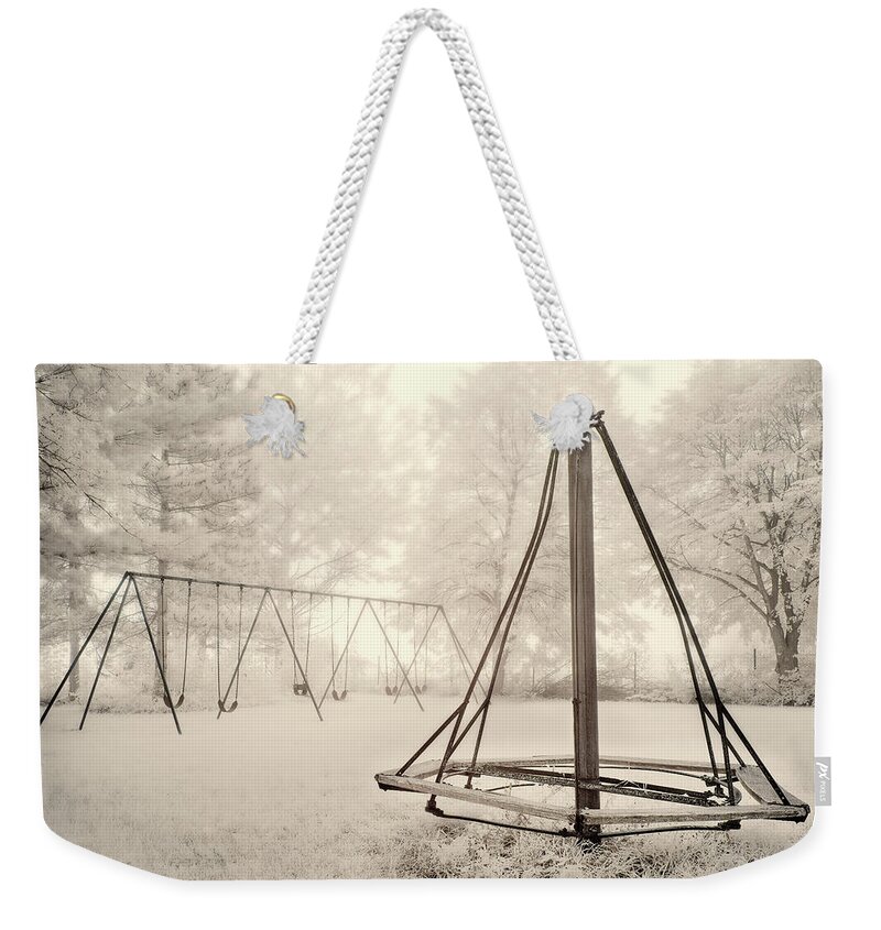 Swingset Weekender Tote Bag featuring the photograph Playground Memories - swings and witches-hat merry go round at Cooksville WI schoolhouse in infrared by Peter Herman