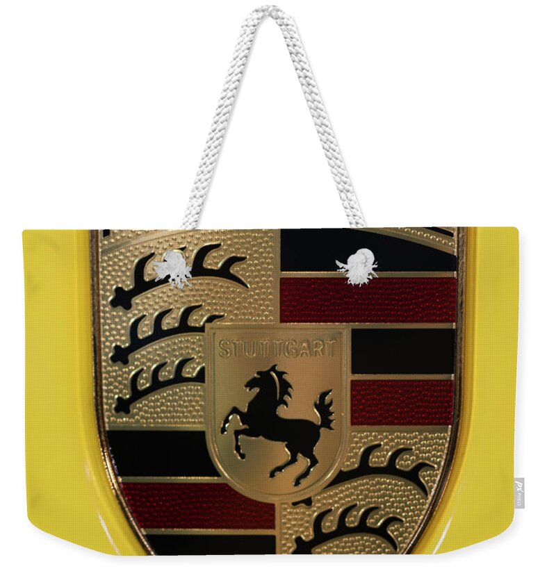 911 Weekender Tote Bag featuring the photograph Porsche Emblem on Racing Yellow by Sebastian Musial