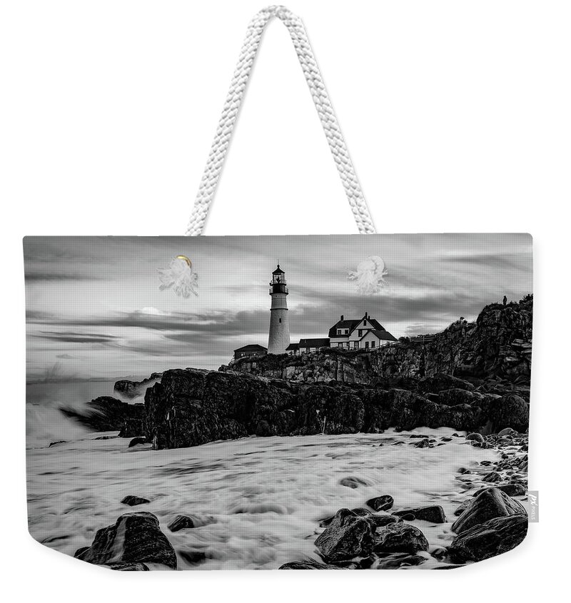 Portland Head Light Weekender Tote Bag featuring the photograph Portland Head Lighthouse With Crashing Waves - Black and White by Gregory Ballos